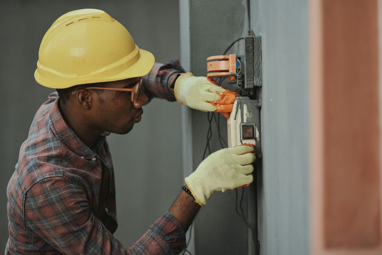 Technician wiring a control panel