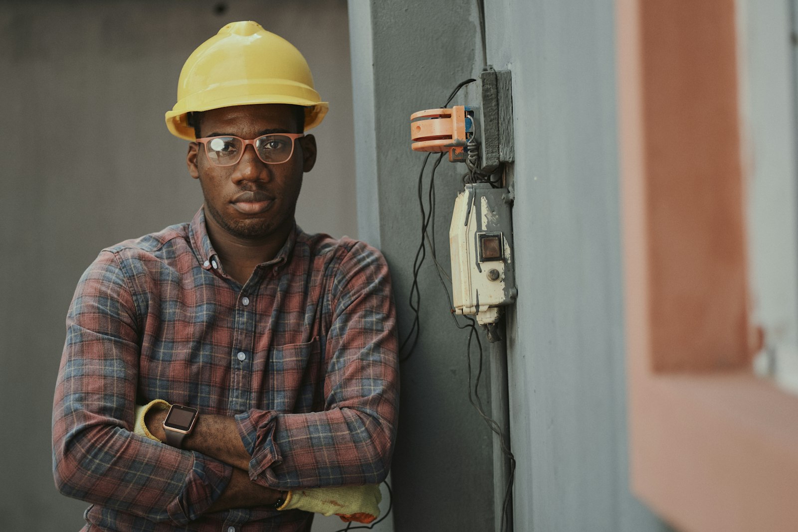 Technician terminating wiring at a panel